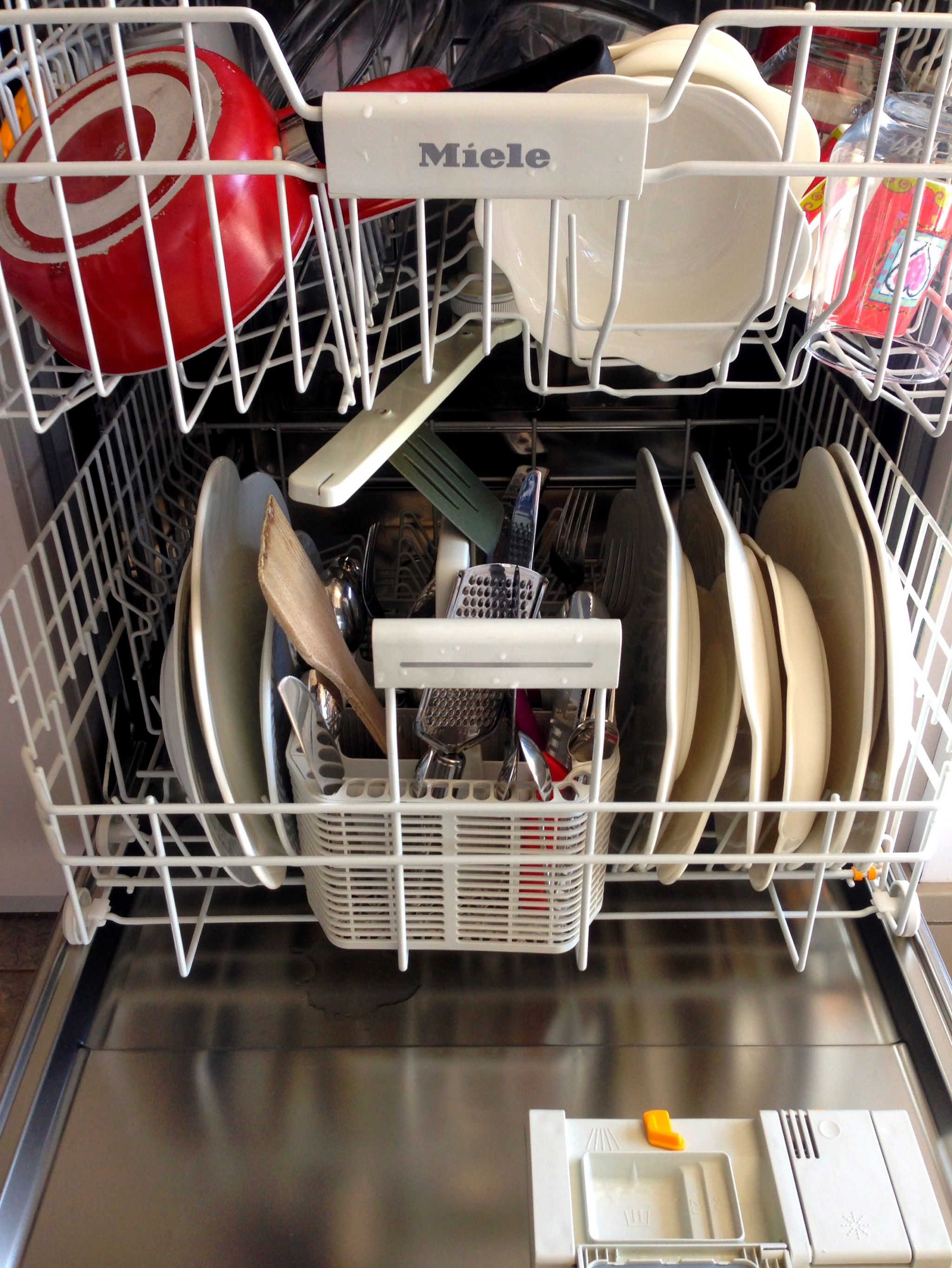 Open dishwasher with clean dishes